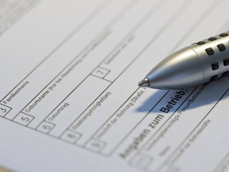 Fragebogen mit Stift